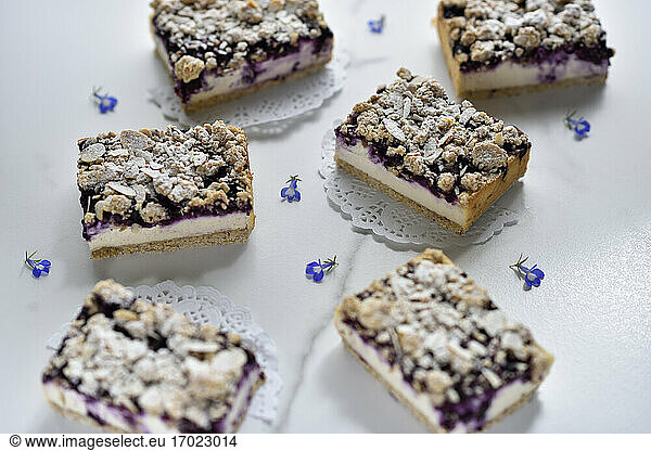Vegan marzipan and blueberry cheesecake with almond crumbles