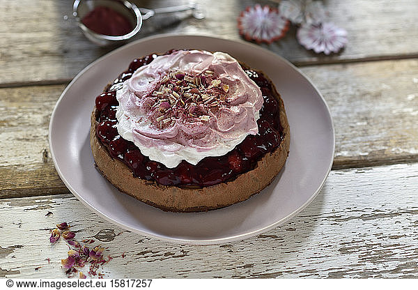 Vegan nougat cheesecake with raspberries and cream