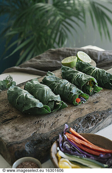 Vegan rolls with vegetables on cutting board