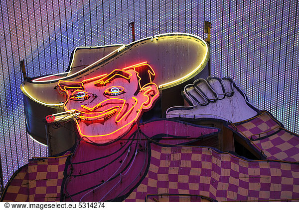 Vegas Vic  famous cowboy figure on a neon sign in old Las Vegas  Pioneer Casino Hotel  Fremont Street Experience  downtown Las Vegas  Nevada  United States of America  USA  PublicGround