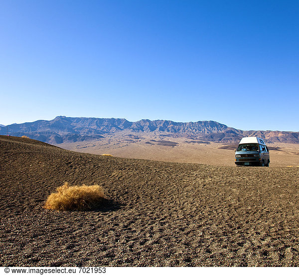 Vehicle in Desert Landscape