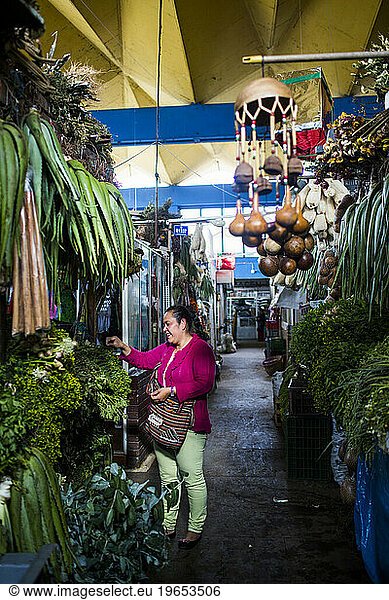 Venders at the Plaza de Mercado deÃ?Â Paloquemao in Bogota  Colombia sell everything from fruits and vegetables to fish to chickens.