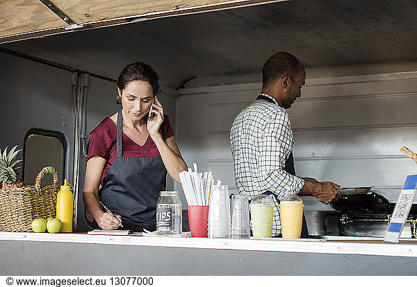 Vendors working in food truck
