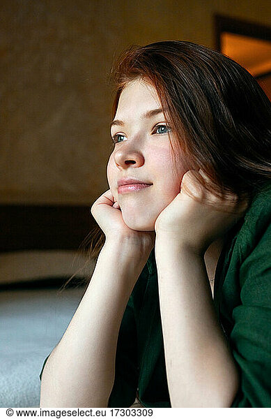 vertical portrait of happy redhead teenage girl