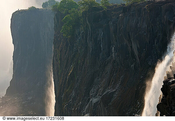 Victoria Falls  huge waterfalls of the Zambezi river flowing over sheer cliffs.