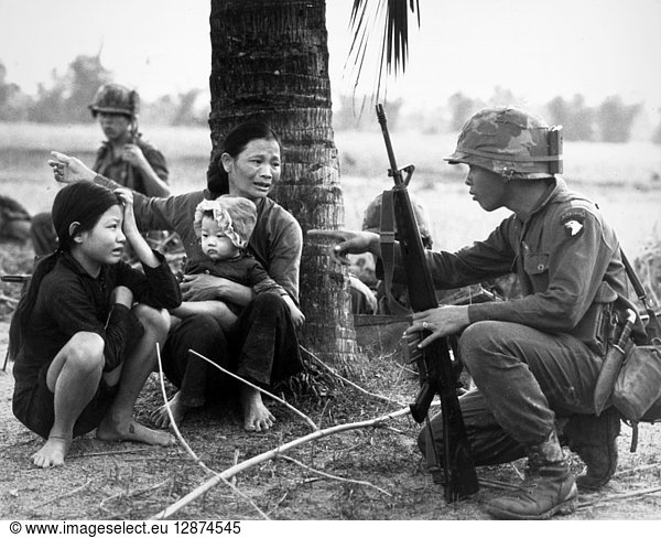 VIETNAM WAR: INTERPRETER. An interpreter questions the family of a Viet ...