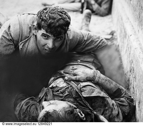 VIETNAM WAR: DYING SOLDIER. A U.S. Marine tries to comfort a dying friend at the Citadel wall in Hue  South Vietnam  during the Tet Offensive  February 1968.