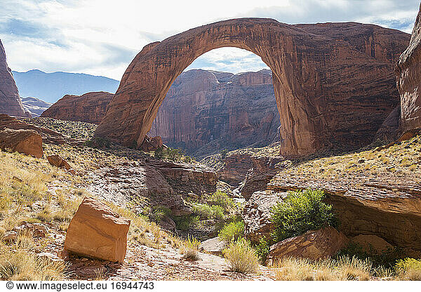 View across rocky landscape to Rainbow Bridge National Monument  Glen Canyon National Recreation Area  Utah  United States of America  North America