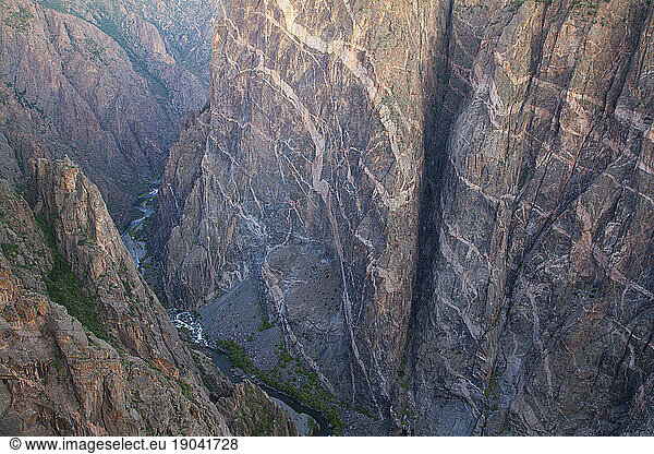 View from a steep cliff into the Black Canyon of the Gunnison National Park in Colorado  USA.