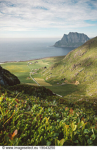 View from above of a valley near the coast with beautiful mountains
