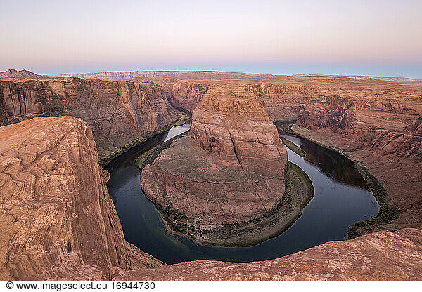 View from cliff edge over the Colorado River at Horseshoe Bend  dawn  Glen Canyon National Recreation Area  Page  Arizona  United States of America  North America