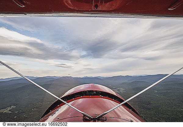 View from cockpit of vintage biplane of White Mountains  New Hampshire