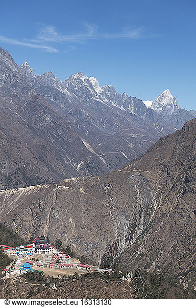 View from height over the Temboche monastery complex in the Khumbu region  steep mountains and deep valleys