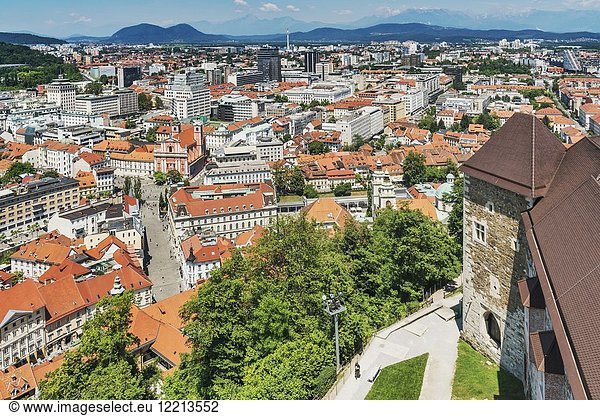 View from Ljubljana Castle over the town  to the Franciscan church (Franciskanska cerkev) and to the bridge Tromostovje (Three Bridges). The buildings are landmarks of Ljubljana  Slovenia  Europe.