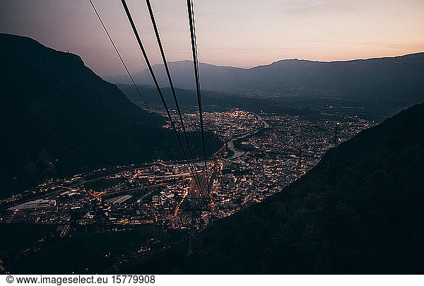 View from the aerial cable car across the city of Bolzano  Lombardy  Italy in the evening.