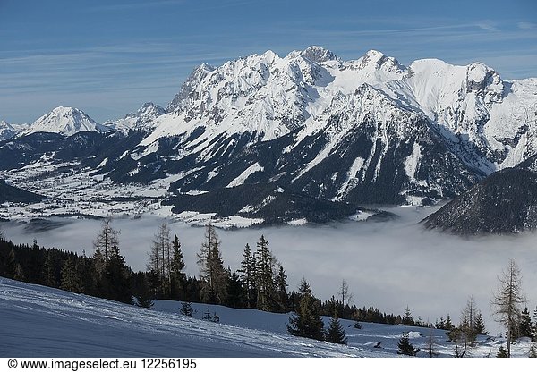 View from the Hauser Kaibling ski mountain to the Dachstein massif with the Enns valley in the fog  region Schladming Dachstein  Ski amade'  Schladming  Styria  Austria  Europe