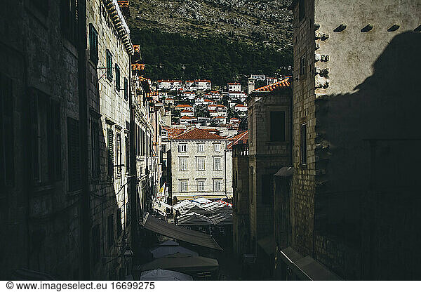 View looking down the center of busy Old Town Dubrovnik buildings