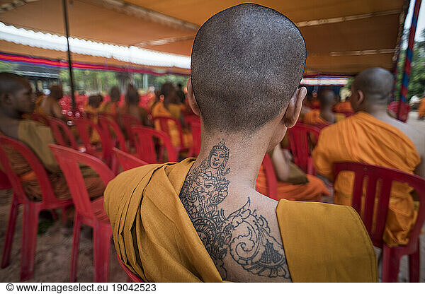 View of a tattoed back of a Buddhist monk  Angkor Wat  Siem Reap  Cambodia.
