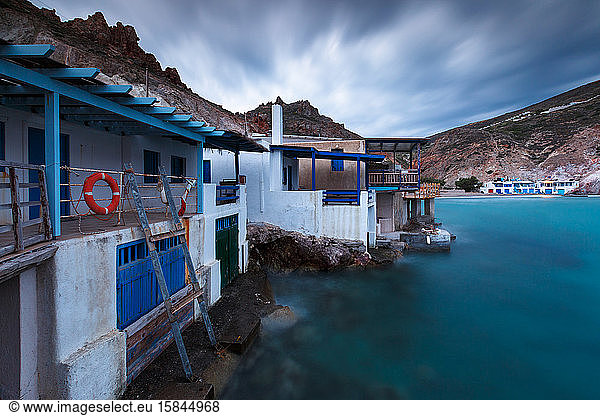 View of boat houses in Firopotamos fishing village on Milos island.