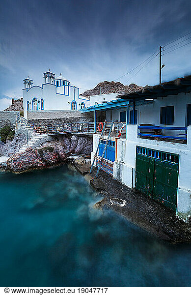 View of boat houses in Firopotamos fishing village on Milos island in