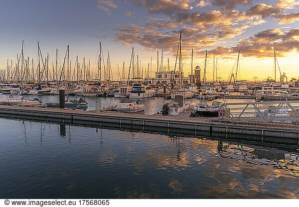 View of boats and lighthouse in Marina Rubicon at sunset  Playa Blanca  Lanzarote  Canary Islands  Spain  Atlantic  Europe