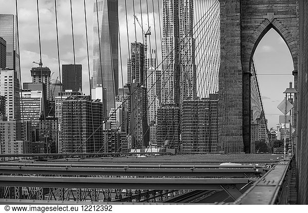 View of Brooklyn Bridge and skyscrapers  B&W  New York  USA