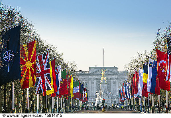View of Buckingham Palace and The Mall lined with flags  London  England  United Kingdom  Europe