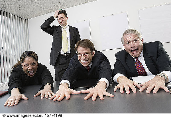 View of business people gesturing in the office.