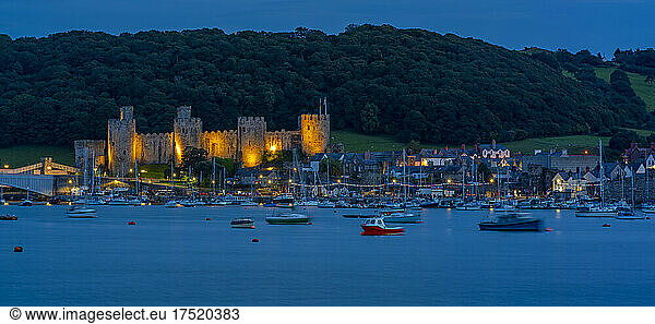 View of Conwy Castle,  UNESCO World Heritage Site,  and Conwy River at dusk,  Conwy,  Gwynedd,  North Wales,  United Kingdom,  Europe