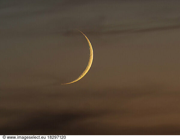 View of crescent moon at dusk