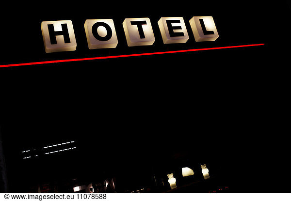 View of hotel sign at night