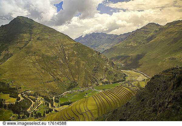 View of mountain valley and Inca terraced fields on mountainsides.