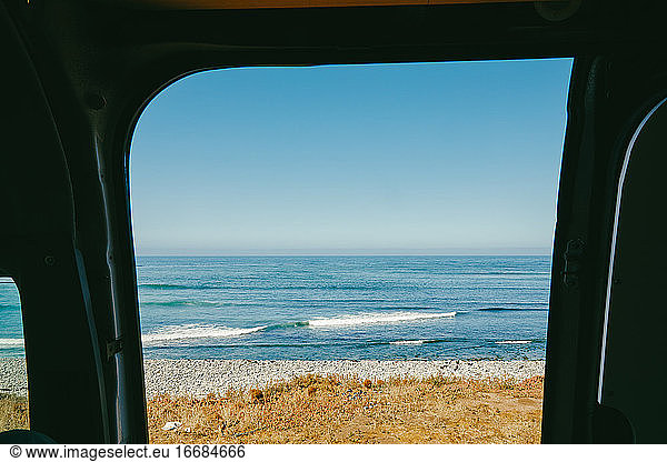 View of ocean from door of a sprinter van in Baja  Mexico.