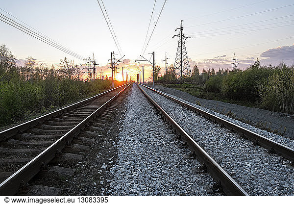 View of railroad tracks during sunset