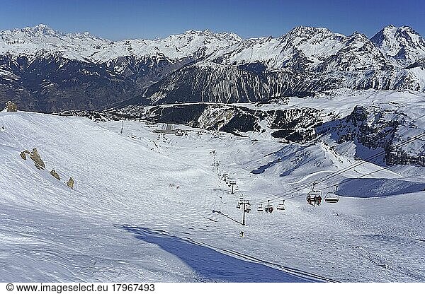 View of ski slope  ski lift  airfield  snow-capped mountains  3 Trois Vallees ski resort  Courchevel  Haute Savoie  High Savoie  France  Europe