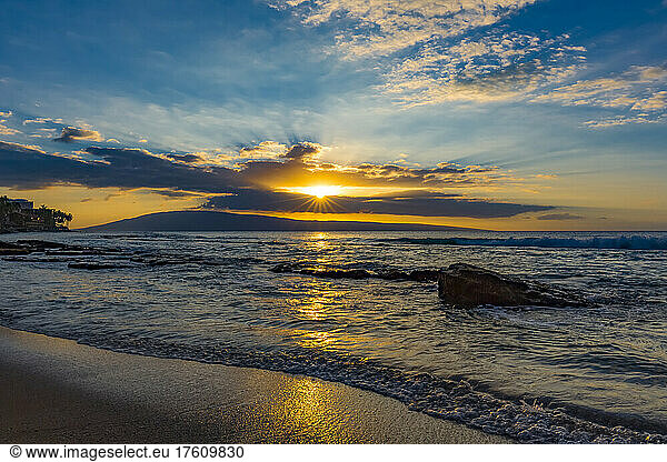 View of the ocean waves at sunset from Ka'anapali Beach with the Island of Lanai on the horizon; Ka'anapali  Maui  Hawaii  United States of America