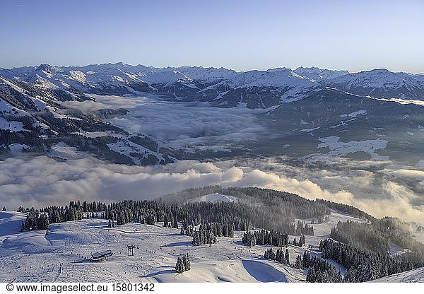 View of the Windautal  mountain panorama in winter  cloud cover in the valley  ski area SkiWelt Wilder Kaiser Brixental  Brixen im Thale  Tyrol  Austria  Europe