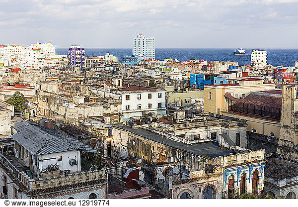View over old building rooftops in Centro Habana  and Straits of Florida  Havana  Cuba  West Indies  Caribbean  Central America