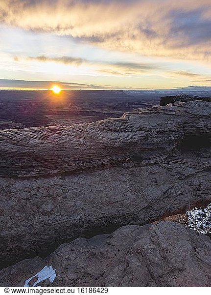 View over the Mesa Arch at sunrise  Colorado River Canyon with the La Sal Mountains in the back  view at Grand View Point Trail  Island in the Sky  Canyonlands National Park  Utah  USA  North America