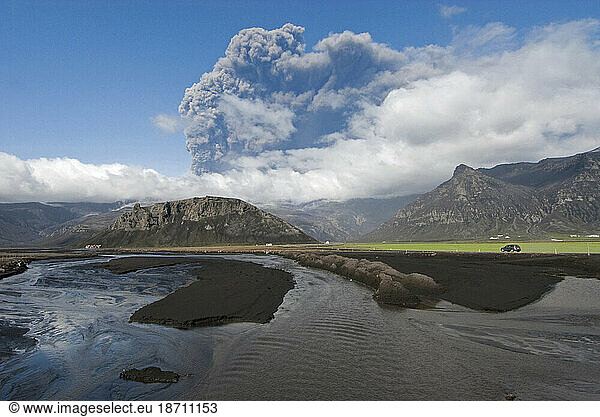 Viewed from the coastal highway  the ash plume continues to erupt from Eyjafjallajokull Volcano near Skogar  Iceland.