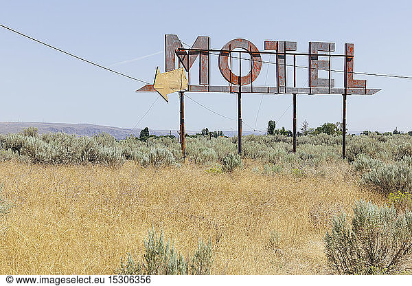 Vintage motel sign with dry scrub-land in foreground  Whitman County  Palouse  Washington  USA.