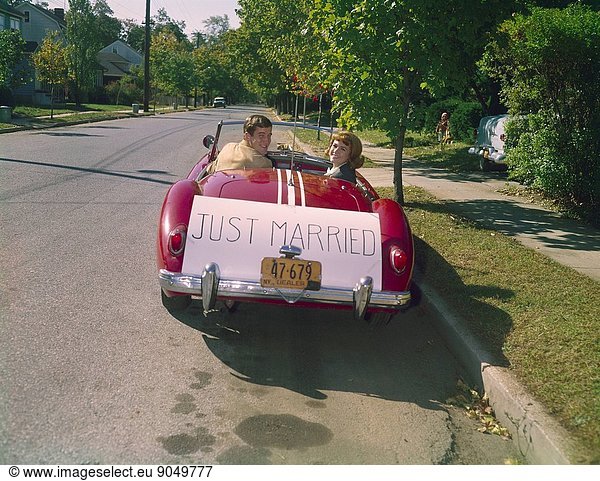 Vintage Newlyweds in an MG with Just Married sign