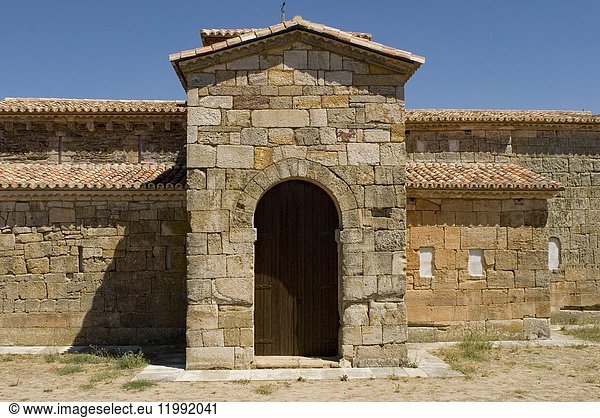 Visigothic church of San Pedro de la Nave made of red sandstone  Seventh Century  Historic and Artisitc National Monument  El Campillo  province of Zamora  Castilla y Leon  Castile  Spain. Transept  Apse and Southern door with Visigothic arch