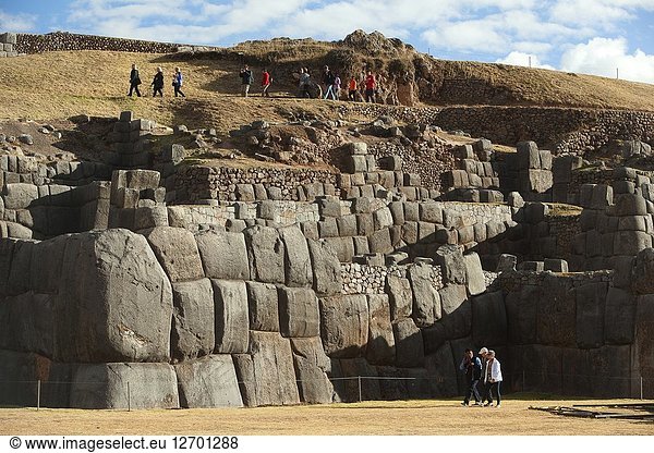 Visitors at the The Saqsaywaman archaeological complex  a massive fortress of the Incas  overlooking the Inca navel of Cusco  Peru  South America