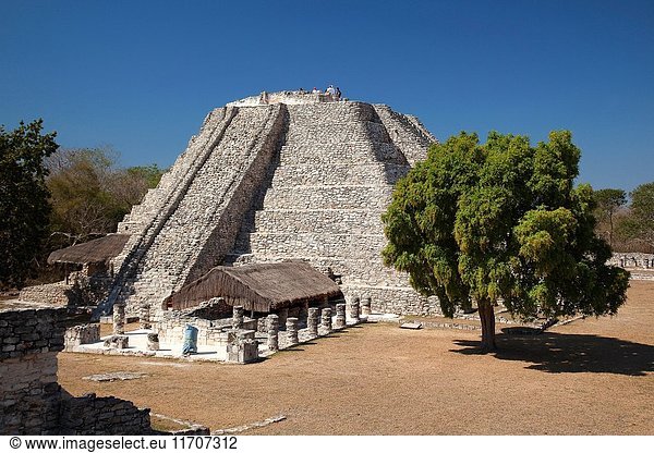 Visitors at the top of the Castle of Kukulcan-Castillo de Kukulcan in Mayapan Archaeological site Merida Yucatan State Mexico Central America.
