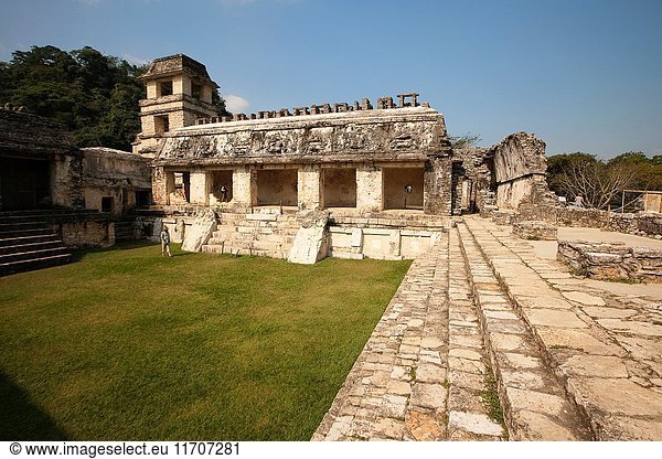 Visitors in front of the Palace-El Palacio at the Patio de los Cautivosin Palenque Archaeological Site  Palenque  Chiapas State  Mexico  Central America.