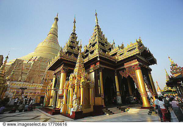 Visitors Walk Around Shwedagon Pagoda At Sunset; Yangon  Burma