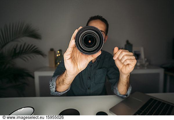 Vlogger showing lens during filming