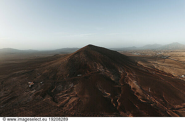 Volcanic mountain peak in front of sky at Fuerteventura