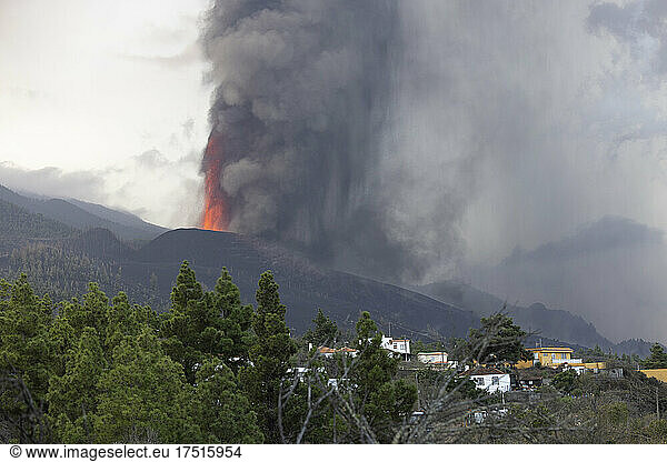 volcano in its first moments of eruption near town